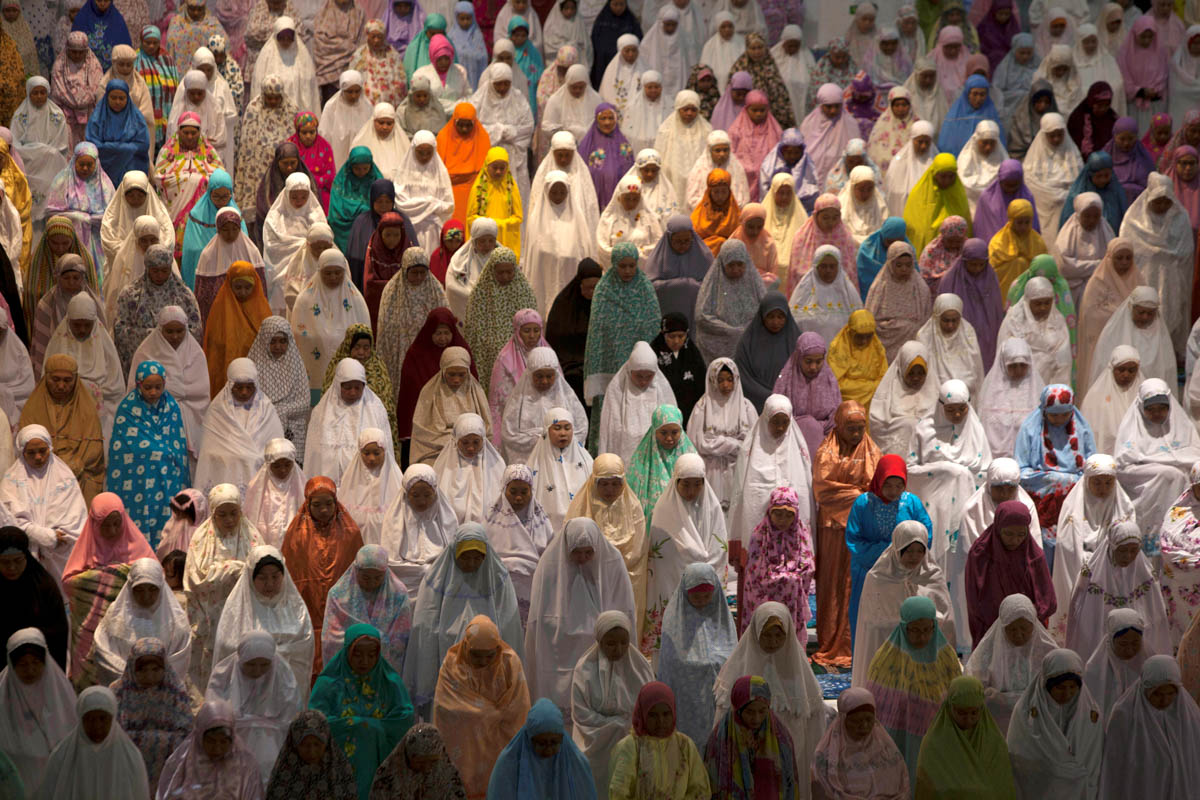Muslim women attend prayers at the first day of the holy fasting month of Ramadan at Al-Akbar Mosque, Surabaya, East Java